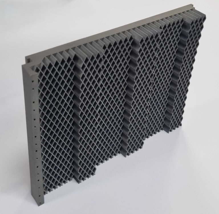 3D printed honeycomb tile created using ABD-1000AM. Photo via Alloyed Ltd.