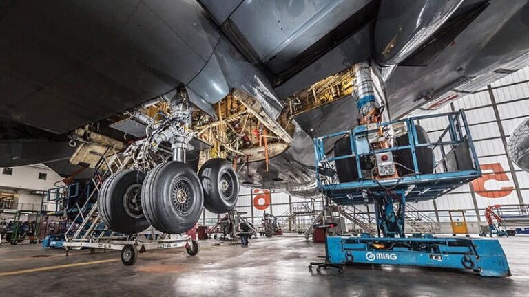 underside view of aircraft undergoing maintenance