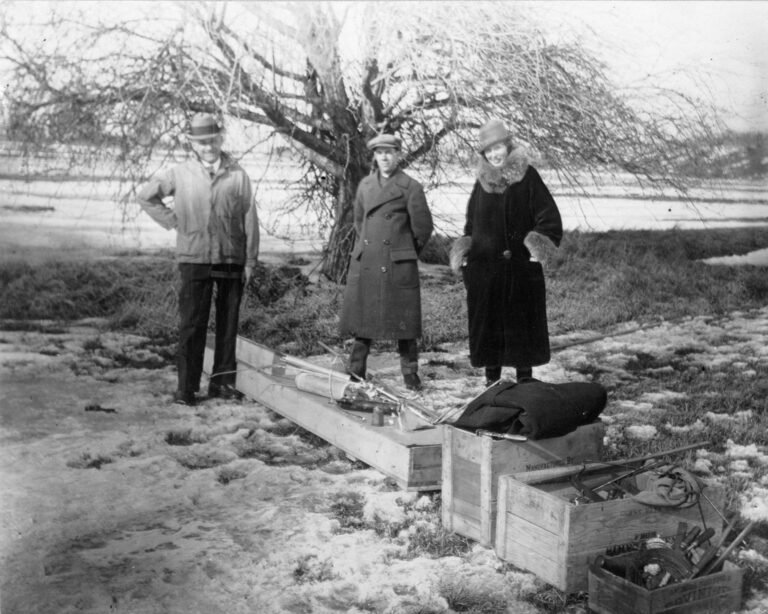 From Cabbages to Countdowns: NASA Marks 100 Years of Modern Rocketry black-and-white photograph of a trio of people standing outdoors with wooden crates at their feet