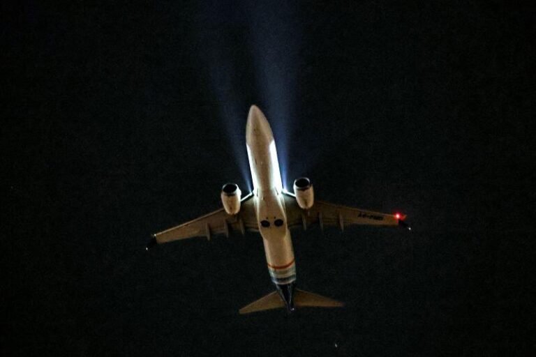 Flydubai aircraft inflight with dark background