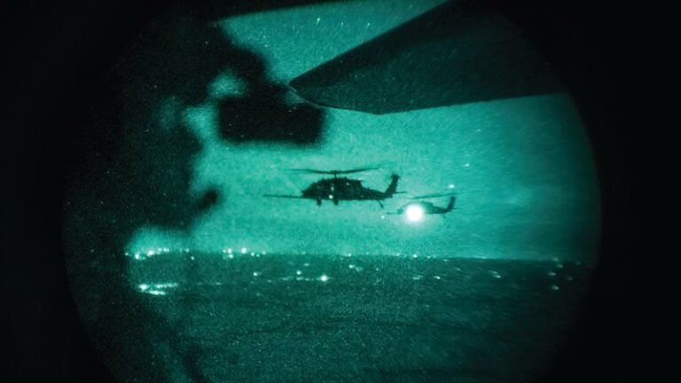 helicopters over city seen through night vision goggles