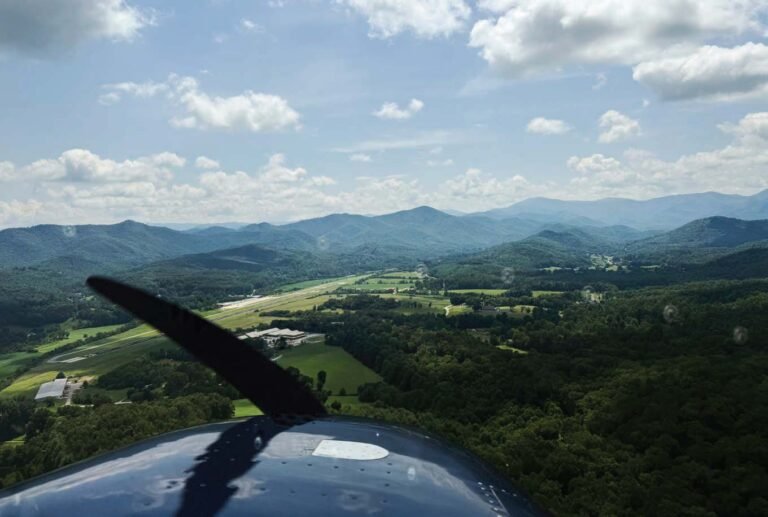 Entering left downwind for Runway 7 at Macon County Airport (1A5) in Franklin, Tennessee. [Credit: Laura Simons]