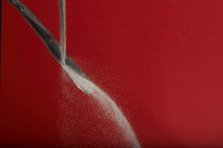 Demonstration of the flow of Metalysis metal powders. Photo via Metalysis