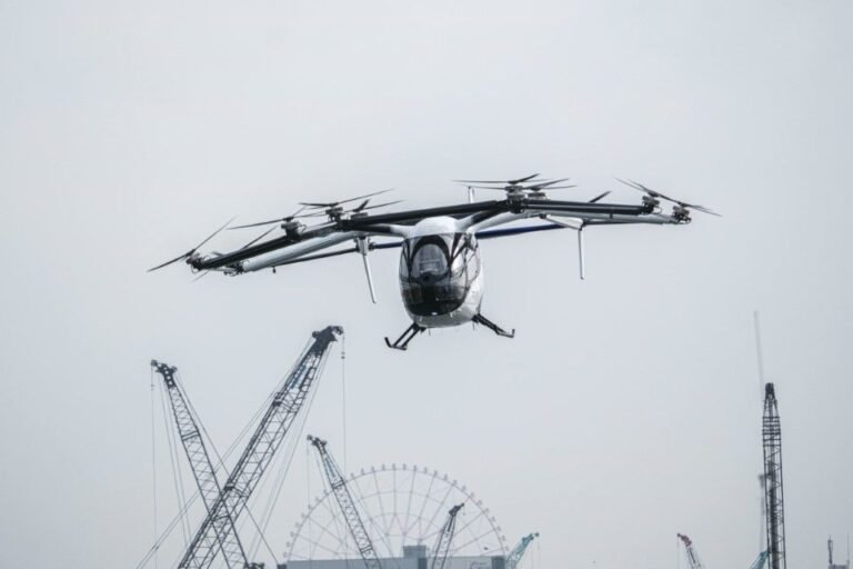 SkyDrive SD-05 eVTOL aircraft in flight over Tokyo Bay