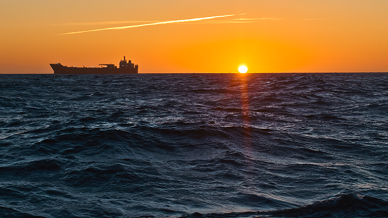 Uninsured shadow fleet vessels are a growing concern for insurers Tanker on horizon as the sun sets