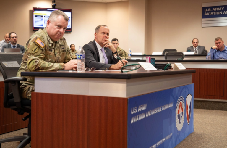 Army’s SkyFoundry Plan To Build Own Cheap Drones Has ‘Evolved,’ Official Notes Commercial Involvement Lt. Gen. Chris Mohan, Army Materiel Command commanding general, and Rich Martin, AMC director of supply chain management, listen to a presentation during the AMC Advanced Manufacturing Summit, December 4, 2025. U.S. Army photo by Lindsay Grant, AMC public and congressional affairs office.