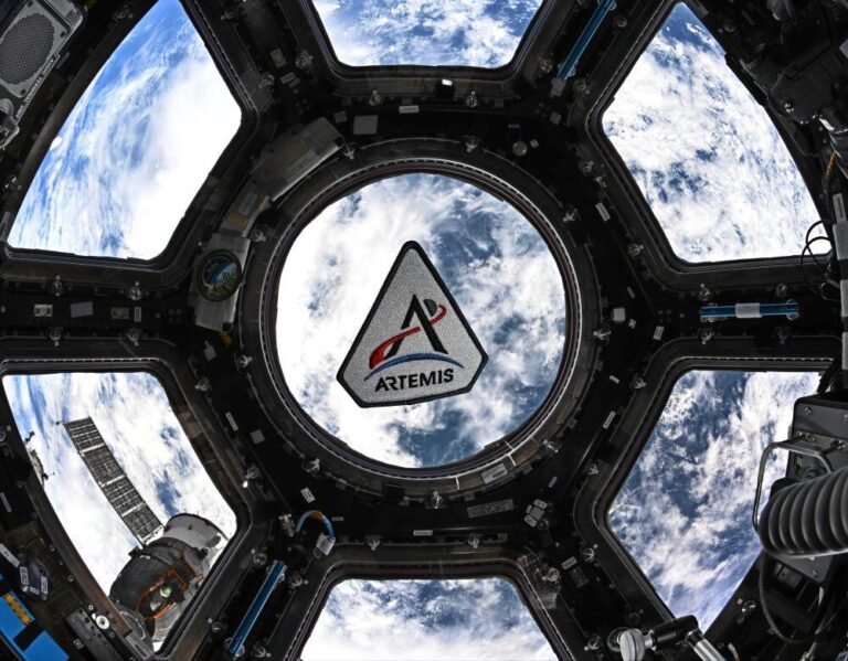 An Artemis program patch floating in the International Space Station’s cupola. Credit: NASA/Jessica Meir (from here: Godspeed, Artemis II! - NASA
