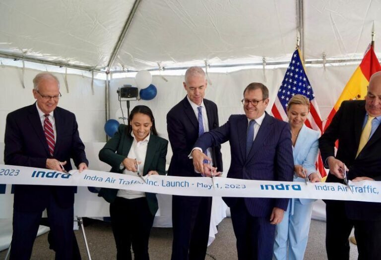 U.S. Sen. Jerry Moran and U.S. Rep. Sharice Davids, both at far left, helped open Indra Air Traffic Inc. in Overland Park, Kansas, in May 2023.