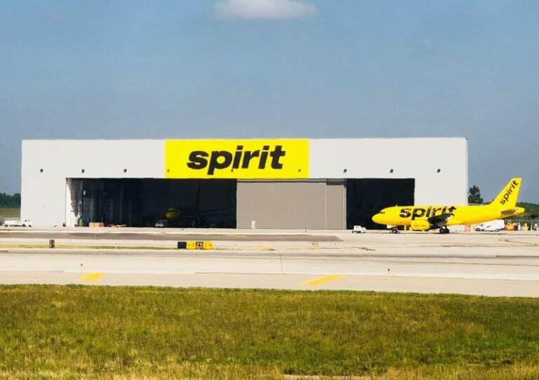 Spirit Airlines aircraft in front of hangar