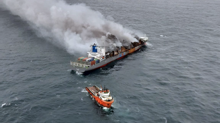 Containership Wai Hai 503 being towed at sea