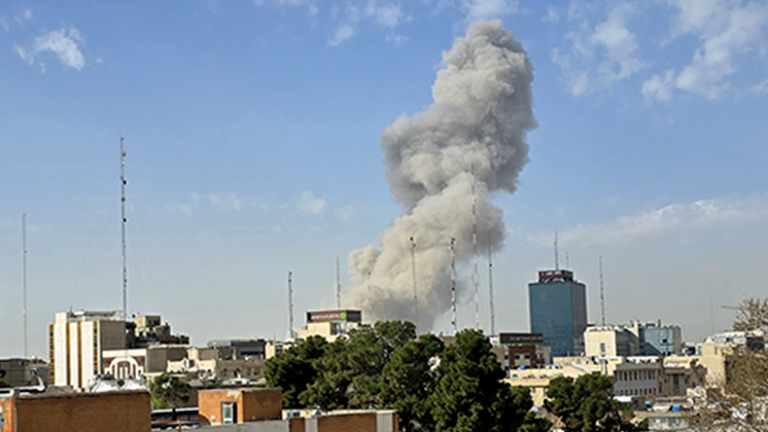 A plume of smoke rises after an explosion on February 28, 2026 in Tehran, Iran. After explosions were seen in the Iranian capital
