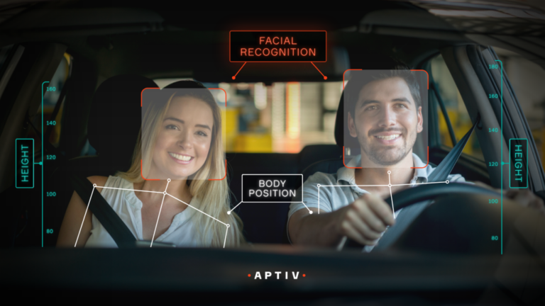 Aptiv introduces camera-only occupant detection system Two people in the front seats of a vehicle with digital information overlaid demonstrating how the occupant detection system works.