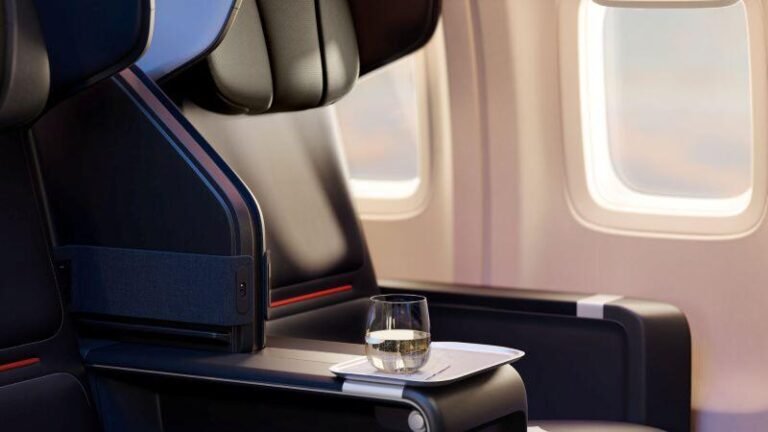 Daily Memo: Yes, Demand Persists; But From Who And For How Long? Delta Premium seating with a wine glass