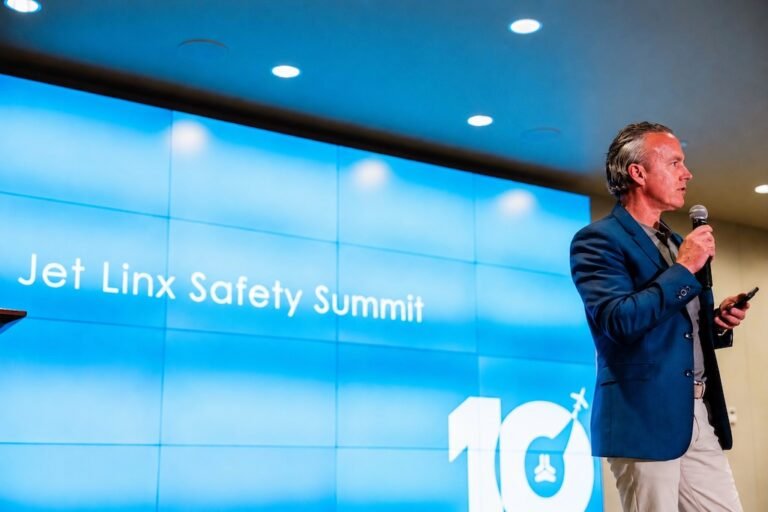 Jamie Walker delivers closing remarks at the Jet Linx Safety Summit in 2026.