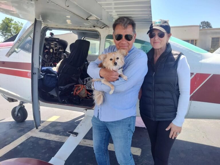 Wildlife rescuers Ken Wayne and his wife, Carole Moshetti, and their dog Mango. [Credit: Flying Tails]