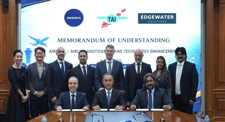 Representatives of Thai Aviation Industries, Edgewater Solutions and Amadeus at a table where the MoU is signed.