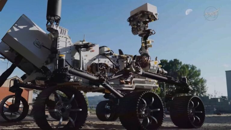 ‘PROMISE’ me the moon? NASA wants to send spare nuclear-powered Mars rover to the lunar surface a six-wheeled rover looks up at the moon in the daytime sky.