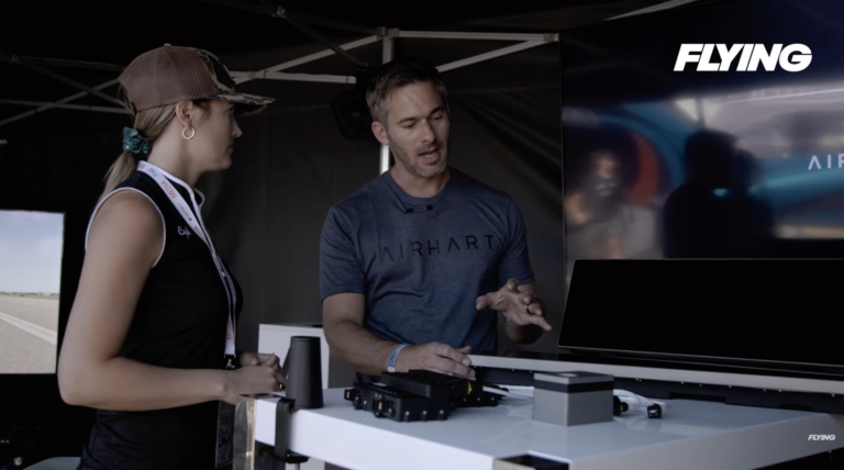 Plane + Pilot magazine’s Cayla McLeod (left) talks with Nate Thuli, president of Airhart Aeronautics, at EAA AirVenture in July. [Credit: FLYING]