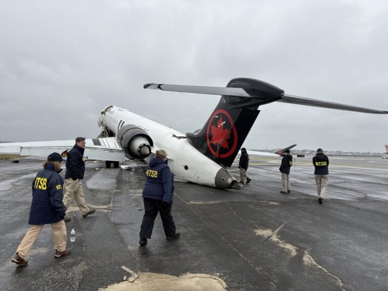 ATC Staffing Levels Scrutinized in LaGuardia Collision Investigation NTSB investigators LaGuardia Airport CRJ 900 fire truck collision