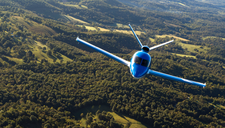 Cirrus Vision Jet over green hills [Credit: Cirrus]