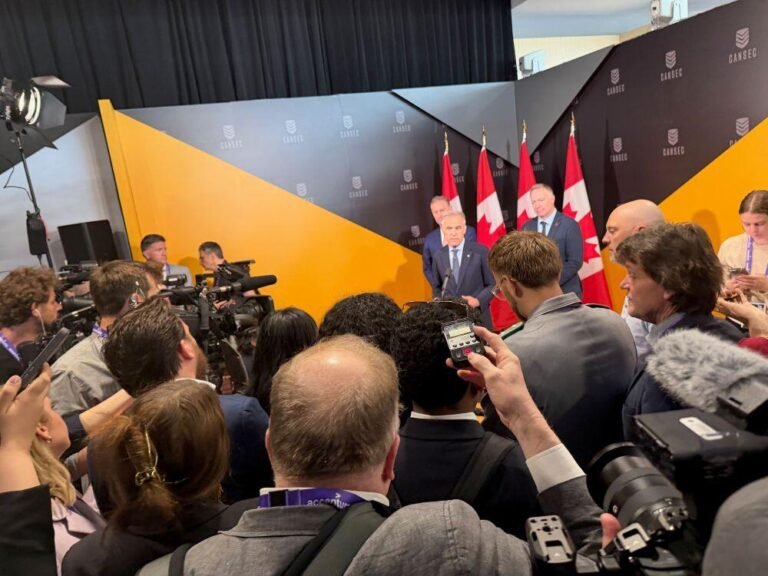 Pic caption: Prime Minister Mark Carney briefs the press during the Cansec exhibition in May.