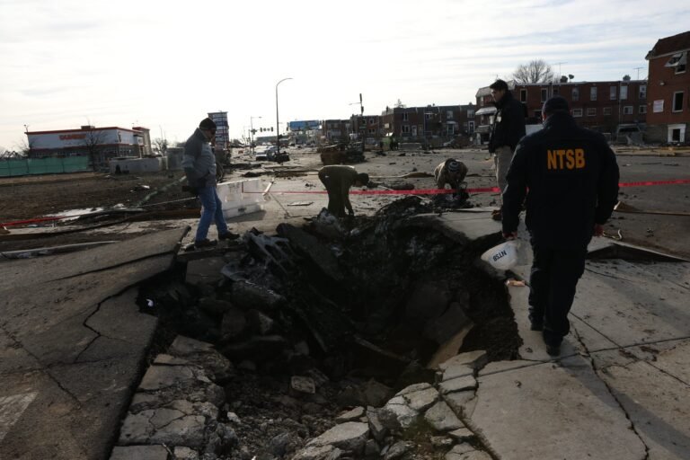 NTSB investigators document the scene of the January 31, 2025, Learjet 55 crash in Philadelphia. [Credit: National Transportation Safety Board]