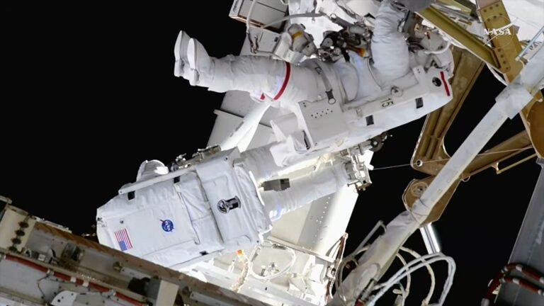 ‘One more step’: NASA astronauts conduct 6.5-hour spacewalk to prep ISS for solar array upgrade Two astronauts in white bulky spacesuits work outside a large space station set against the blackness of space.