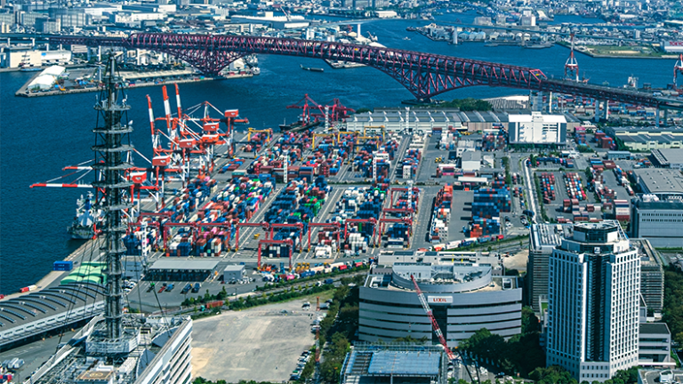 S&P upgrades Japan Club outlook Aerial view of Osaka port container terminal with Red Arch bridge and city skyline