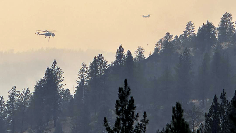 Spokane fire losses could hit $1bn mark Spokane fires of summer 2026 in Washington state with helicopters battling forest flames