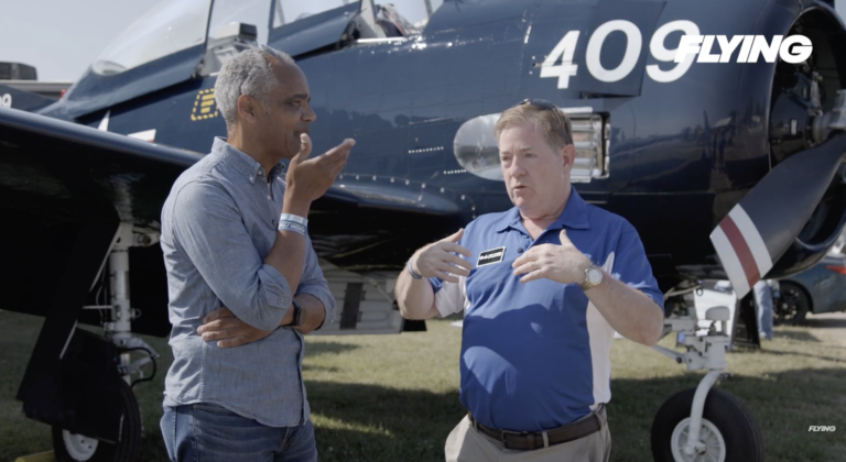 The Aviation Consumer’s Jonathan Welsh (left) talks with Chris D'Acosta, CEO of Swift Fuels, at EAA AirVenture in July. [Credit: FLYING]