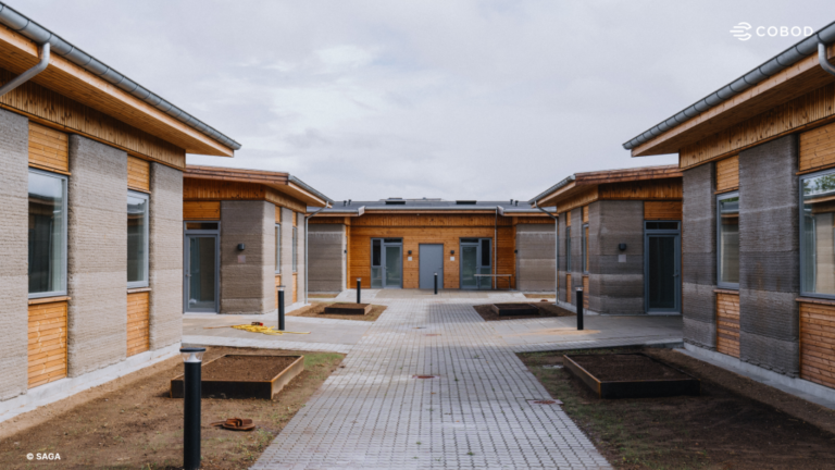 3DCP Group Completes 36 3D Printed Student Apartments Below Denmark’s Subsidized Housing Cost Cap The buildings arranged around a shared courtyard, with paths and planting beds. Photo via COBOD.