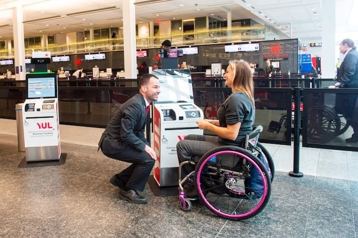 Air Canada brings in new policy to help customers with mobility aids An Air Canada staff member helping a lady in a wheelchair at the airport