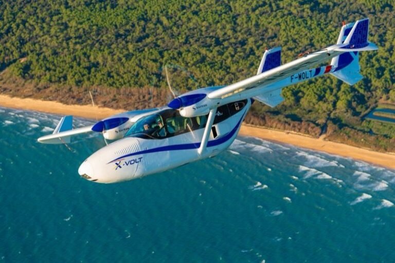 Aura Aero flies VoltAero’s Cassio S as X-VOLT testbed The X-VOLT hybrid-electric demonstrator in flight over a coastline, showing its twin-boom airframe and rear-mounted propulsion