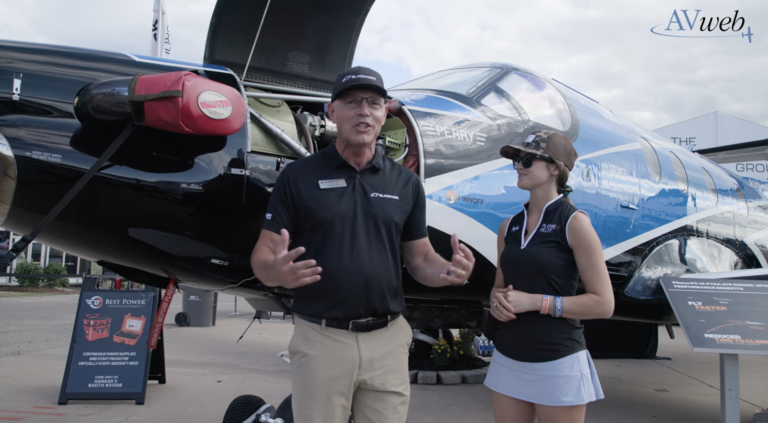 Plane + Pilot magazine’s Cayla McLeod (right) talks with Edwin Black (left), president of Blackhawk Aerospace, at EAA AirVenture in July. [Credit: AVweb]