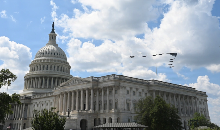 Debrief: Why Defense Investors Face More Than A Turbulent Year-End u.s. capitol with military jets flying overhead