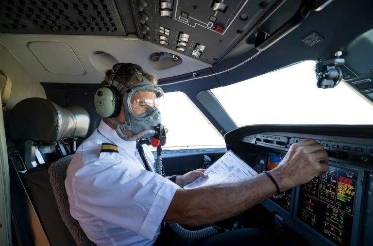 FAA Proposes Relaxing Part 135 and 91 Oxygen Mask Rules pilot in cockpit wearing oxygen mask