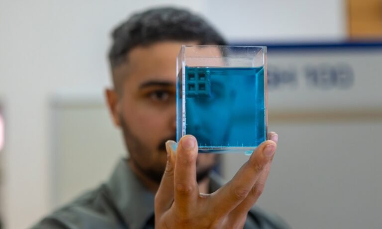 How RMIT Researchers Made 3D Printed Titanium Float on Water Dr Jordan Noronha holding a sample of the floating titanium. Photo via Sara Tan, RMIT University.