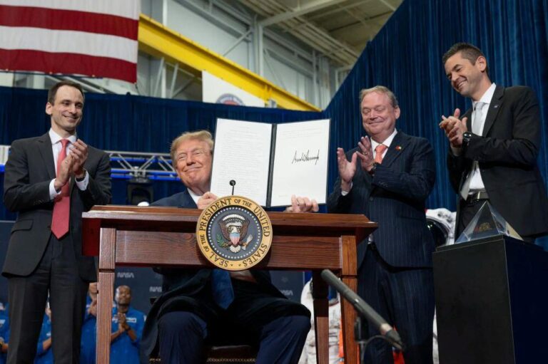 President Donald Trump (second from left) presents an executive order establishing the United States Space Academy during an event on Aug. 28, 2026 at NASA’s Johnson Space Center in Houston to award the Congressional Space Medal of Honor to the Artemis II crew flanked by Michael Kratsios, director of the Office of Science and Technology Policy, left; Kevin Hassett, director of the National Economic Council, third from left; and NASA Administrator Jared Isaacman, right. Credit: NASA/John Kraus
