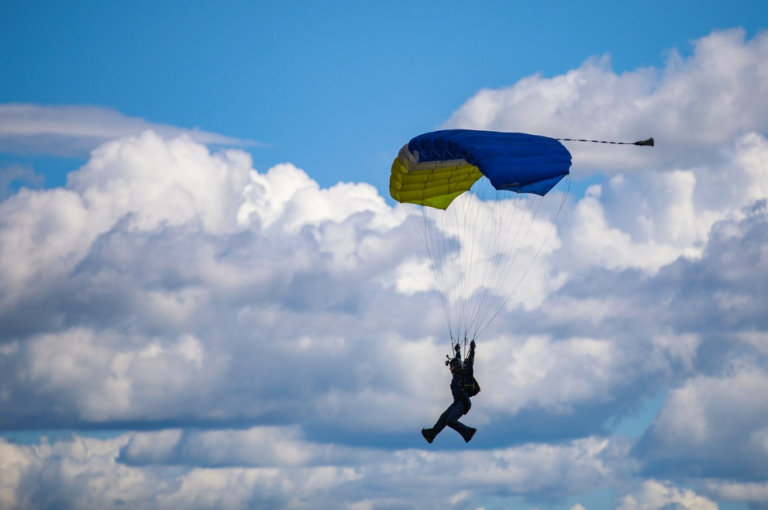 Skydiver with parachute deployed [Credit: Shutterstock]