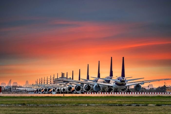 The aircraft order backlog has surpassed 17,000 for the first time Airplanes parked at the maintenance area of an airport