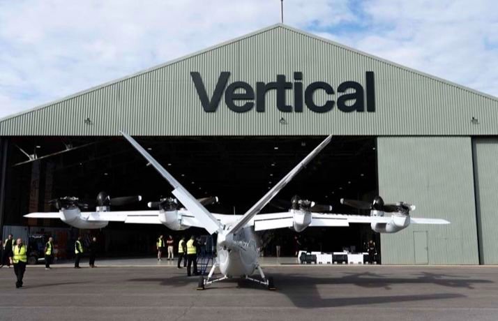 Vertical Aerospace opens Valo eVTOL assembly center at Cotswold Airport Vertical Aerospace's Valo electric air taxi outside the company's hangar at Cotswold Airport, with staff standing around it