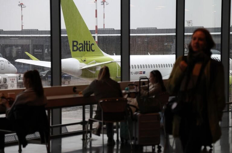 AirBaltic tail viewed from airport terminal