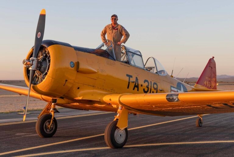 Karl Gashler poses with his T-6, a legendary airplane that trained thousands of World War II aviators for the rigors of flying fighter aircraft. [Credit: David McKay]