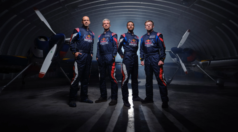 Red Bull Aerobatic Team pilots posing in front of XA42 XtremeAir aircraft