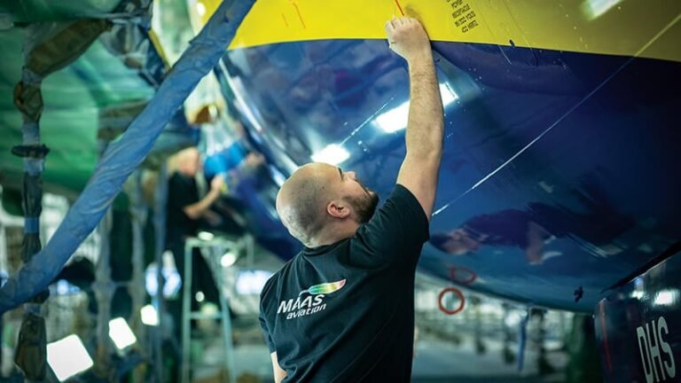 MAAS Aviation employee working on aircraft