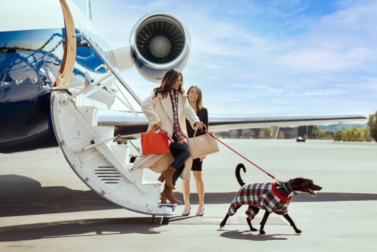 Dog and owner arriving at a Jet Linx private terminal for a pet-friendly private jet flight.