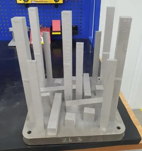 IMI and TotalEnergies qualify printed nickel alloy trims for sour gas Additively manufactured metallic test specimens on a build plate. Photo via IMI.