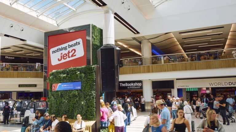 Large advertising display on the concourse at London Gatwick airport.