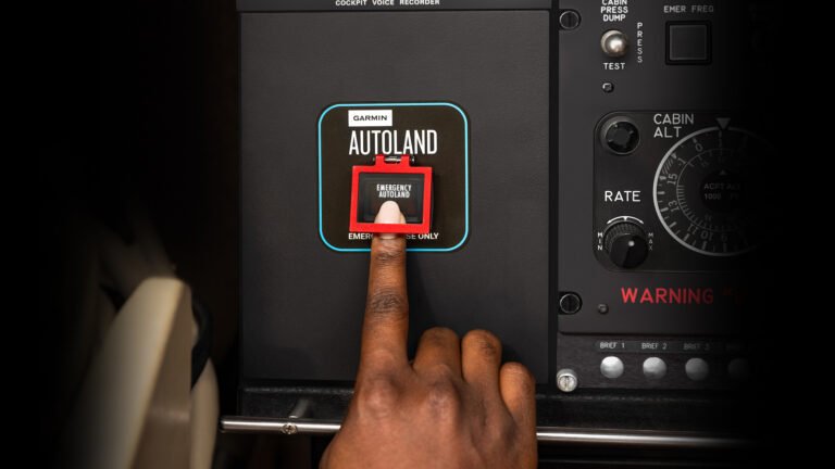 More Than 2,500 Aircraft Now Equipped With Garmin Autoland person pushing Garmin Autoland button