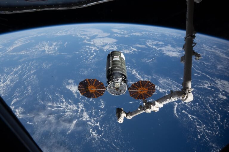 NASA to Cover Northrop Grumman CRS-24 Spacecraft Departure iss074e0458241 (April 13, 2026) --- Northrop Grumman's Cygnus XL cargo spacecraft rests at its capture point, 12 meters from the International Space Station, as the Canadarm2 robotic arm prepares to grapple the resupply ship. Cygnus XL delivered more than 11,000 pounds of new science experiments, lab hardware, and crew supplies for the Expedition 74 crew.